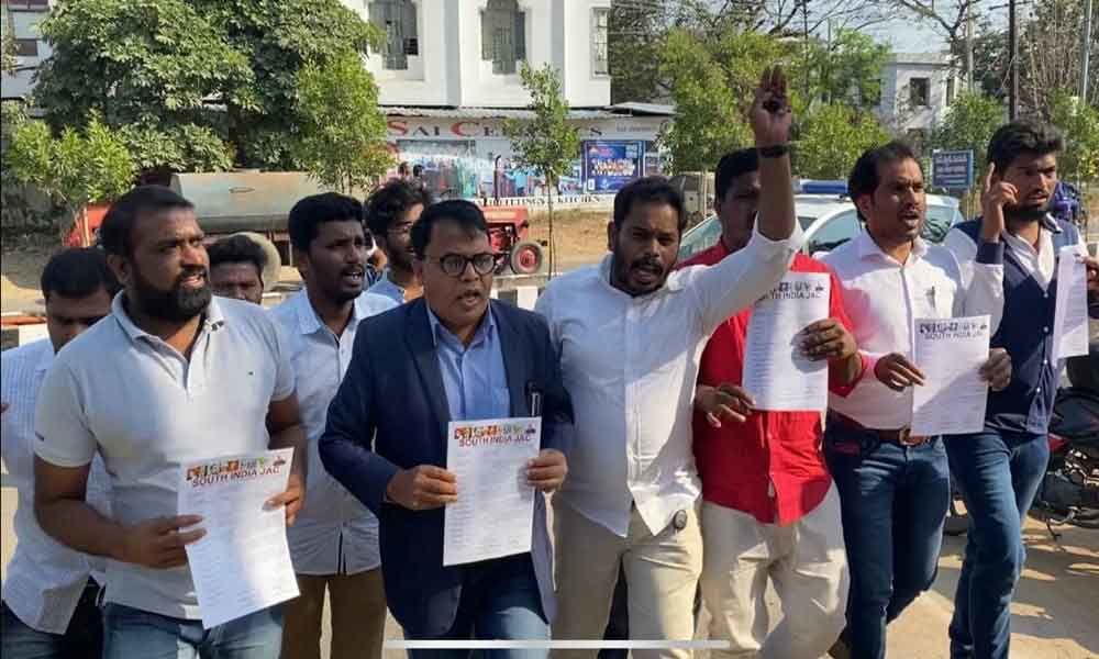South India JAC chairman and Head of the Department of Law, Osmania University, Professor Gali Vinod Kumar and others heading to Subedari Police Station in Hanamkonda on Friday
