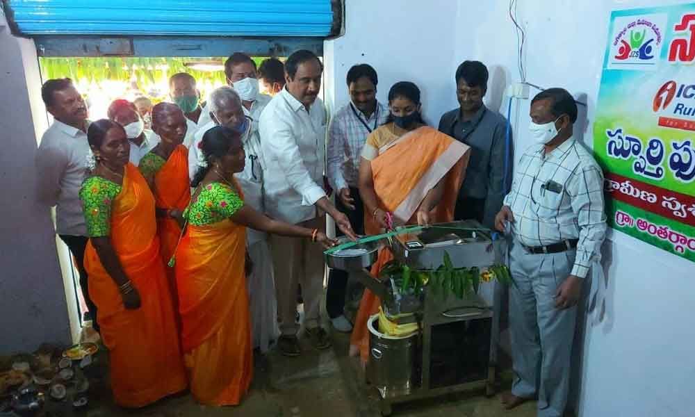Jagtial MLA Dr Sanjay Kumar inaugurating a foodgrains processing machine set up by an SHG in Anthargam village of Jagtial mandal on Friday